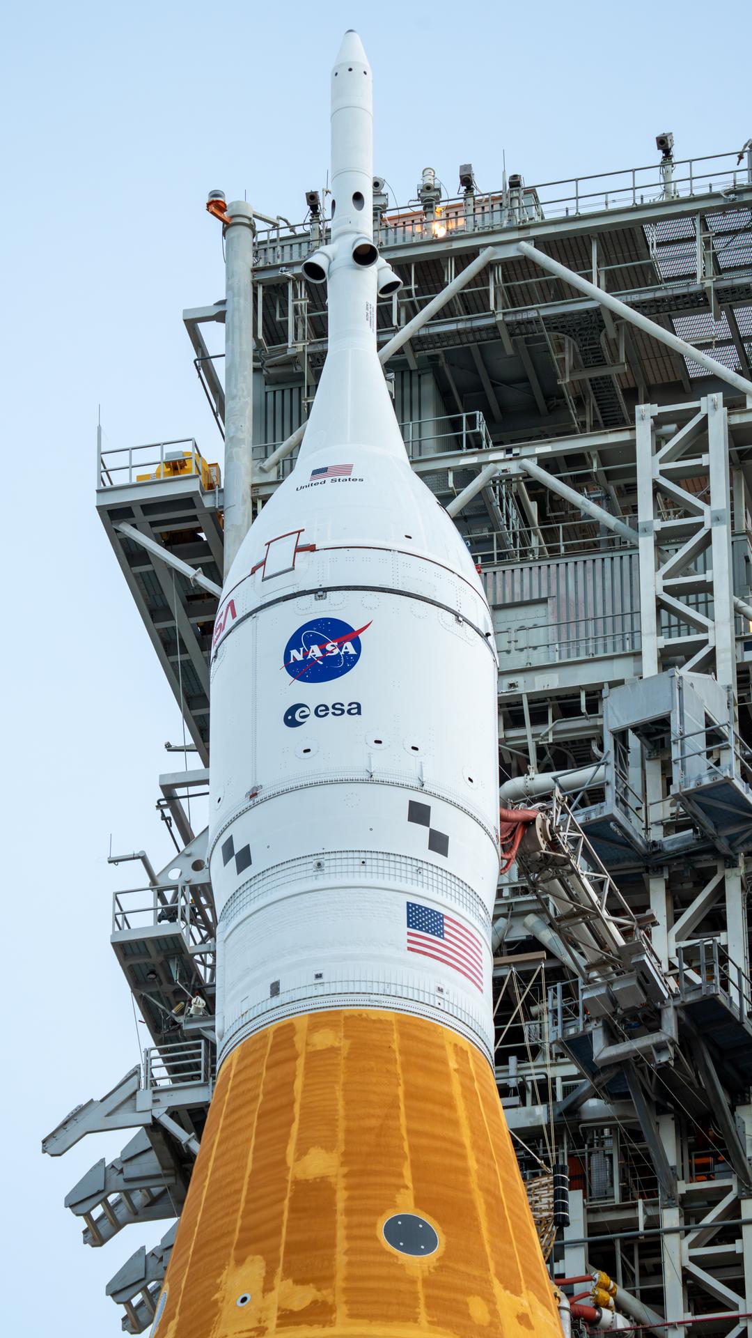 This image shows NASA’s SLS (Space Launch System) and Orion spacecraft rolling out of the Vehicle Assembly Building at NASA’s Kennedy Space Center. NASA's massive Crawler-Transporter, upgraded for the Artemis program, carries the powerful SLS rocket and Orion spacecraft on the Mobile Launcher from the Vehicle Assembly Building to Launch Pad 39B at Kennedy Space Center in preparation for the Artemis II mission. 